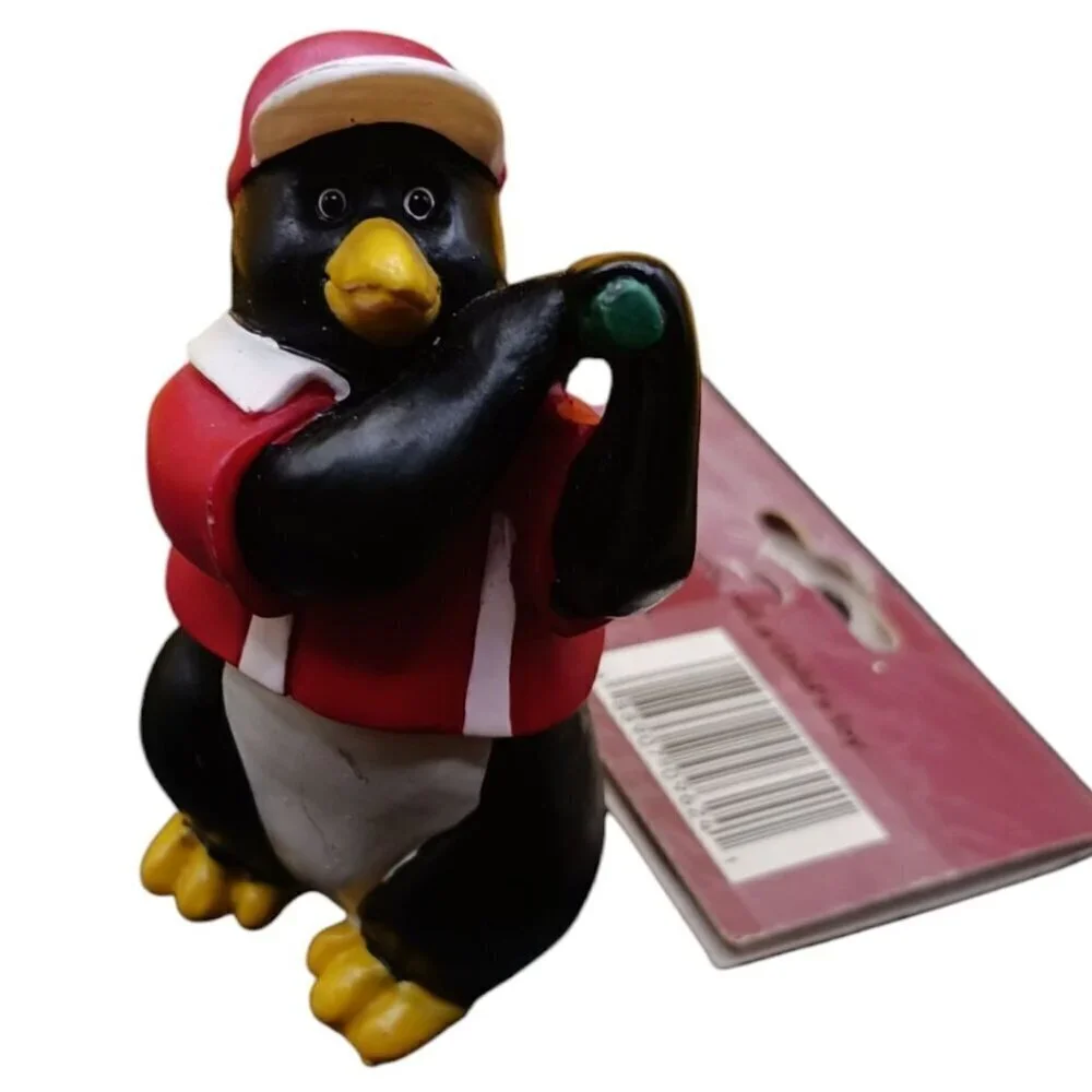 Trim a traditional golfing penguin christmas ornament